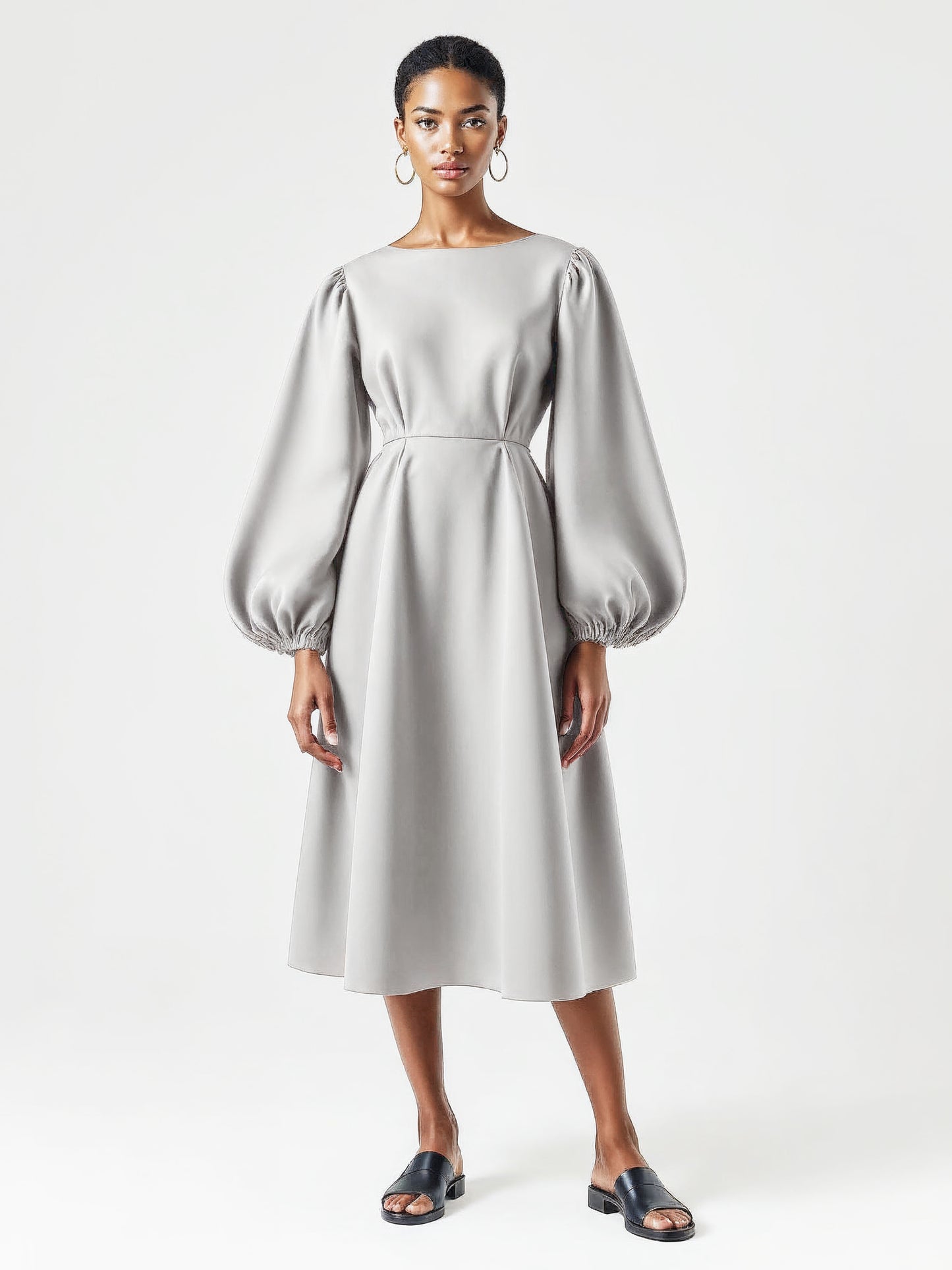Light grey dress with voluminous balloon sleeves and a flared mid-calf silhouette.